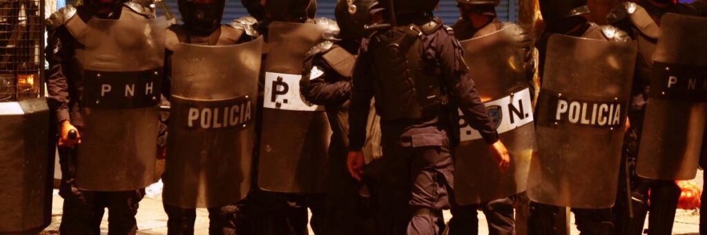 line of policia with shields