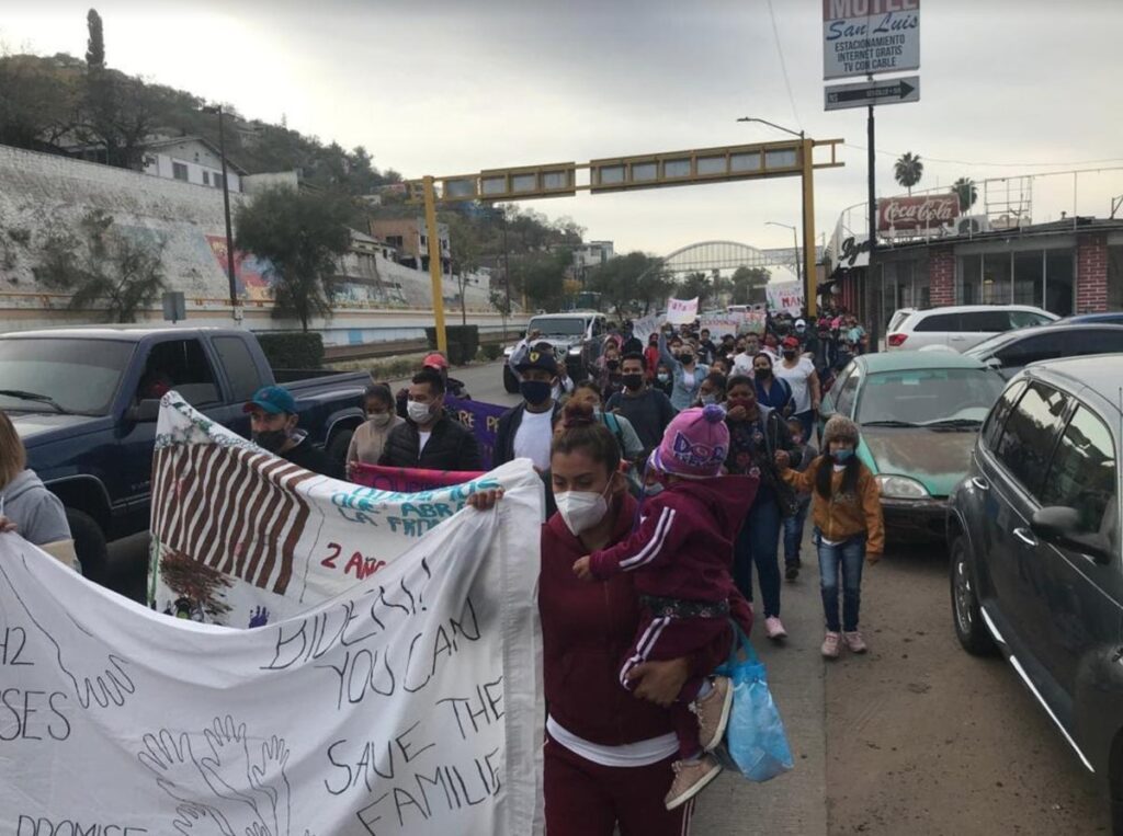 Asylum seekers march to protest border closure on November 8 in Nogales, Mexico.