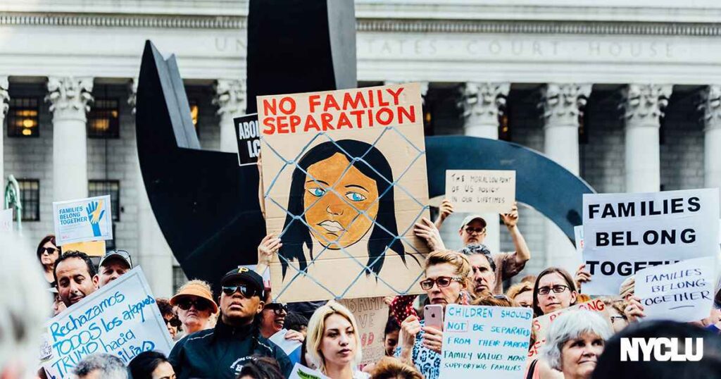 group of demonstrators with signs - No Family Separation