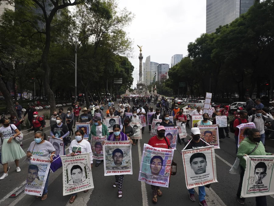 Family members and friends march seeking justice for the missing 43 Ayotzinapa students in Mexico City